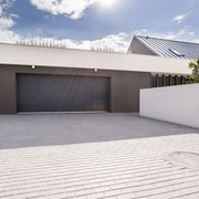 Modern concrete garage for couple cars with big driveway